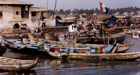 Colourful fishing vessels in Cape Coast.