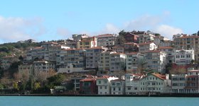 The banks are lined on both sides by the ever-growing Istanbul